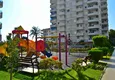 Buy 3+1 linear apartment with furniture, sea and mountain views on the beachfront - Tosmur, Alanya 13 