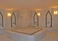 Buy 3+1 linear apartment with furniture, sea and mountain views on the beachfront - Tosmur, Alanya 27 