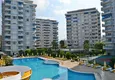 Buy 3+1 linear apartment with furniture, sea and mountain views on the beachfront - Tosmur, Alanya 2 