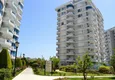 Buy 3+1 linear apartment with furniture, sea and mountain views on the beachfront - Tosmur, Alanya 6 