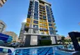 Buy 1+1 apartment in Mahmutlar with furniture and mountain views 1