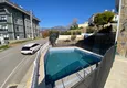 Buy 3+1 two-storey private house with pool and fully furnished in Kargicak 10 