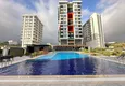 Buy 2+1 apartment with furniture, glazed balcony and sea view in the center of Mahmutlar, Alanya 2 