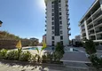 Kupić Nowy apartament 1+1 w Mahmutlar, Alanya - nowy budynek z widokiem na góry 1