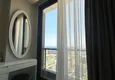 Affordable Purchase 2+1 apartment with panoramic view and partially furnished — Alanya, Mahmutlar 18