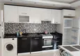Dostępny zakup Apartament 1+1 w Tosmur z meblami krok od morza — nadaje się do uzyskania zezwolenia na pobyt 2 
