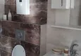 Dostępny zakup Apartament 1+1 w Tosmur z meblami krok od morza — nadaje się do uzyskania zezwolenia na pobyt 9 