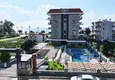 Buy 1+1 apartment overlooking the sea and the fortress on the beachfront in Kestel 9 
