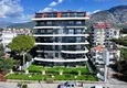 Buy 1+1 apartment overlooking the sea and the fortress on the beachfront in Kestel 12 