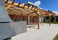 Buy 1+1 apartment overlooking the sea and the fortress on the beachfront in Kestel 23 