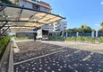 Buy 1+1 apartment overlooking the sea and the fortress on the beachfront in Kestel 24 