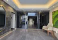 Buy 1+1 apartment overlooking the sea and the fortress on the beachfront in Kestel 28 