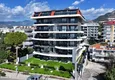 Buy 1+1 apartment overlooking the sea and the fortress on the beachfront in Kestel 11 