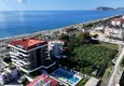 Buy 1+1 apartment overlooking the sea and the fortress on the beachfront in Kestel 1 