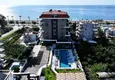 Buy 1+1 apartment overlooking the sea and the fortress on the beachfront in Kestel 5 