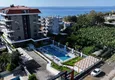 Buy 1+1 apartment overlooking the sea and the fortress on the beachfront in Kestel 7 
