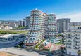Buy Apartment 1+1 in the center of Mahmutlar - on the 12th floor with furniture and mountain views 1