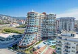 Buy Apartment 1+1 in the center of Mahmutlar - on the 12th floor with furniture and mountain views 2