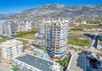 Buy Apartment 1+1 in the center of Mahmutlar - on the 12th floor with furniture and mountain views 4