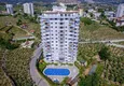 Buy 1+1 apartment in Mahmutlar — new furniture, 70 m², glazed balcony, sea and mountain views 1