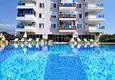 Buy 1+1 apartment in Mahmutlar — new furniture, 70 m², glazed balcony, sea and mountain views 11