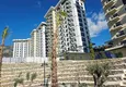 Kupić Nieruchomość w Alanyi z widokiem na morze - apartament 1+1 w Mahmutlar 9 