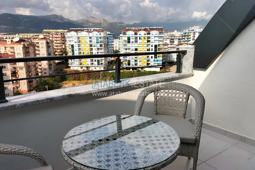 Purchase 1+1 penthouse with sea and mountain views in Alanya Tosmur B21 district 13