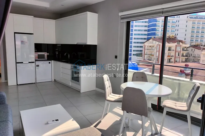 Purchase 1+1 penthouse with sea and mountain views in Alanya Tosmur B21 district 6