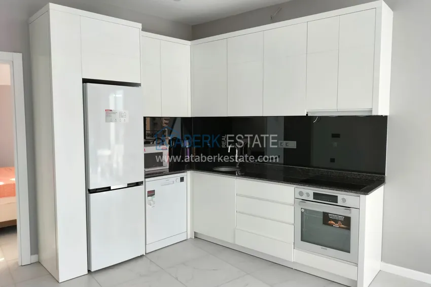Purchase 1+1 penthouse with sea and mountain views in Alanya Tosmur B21 district 7