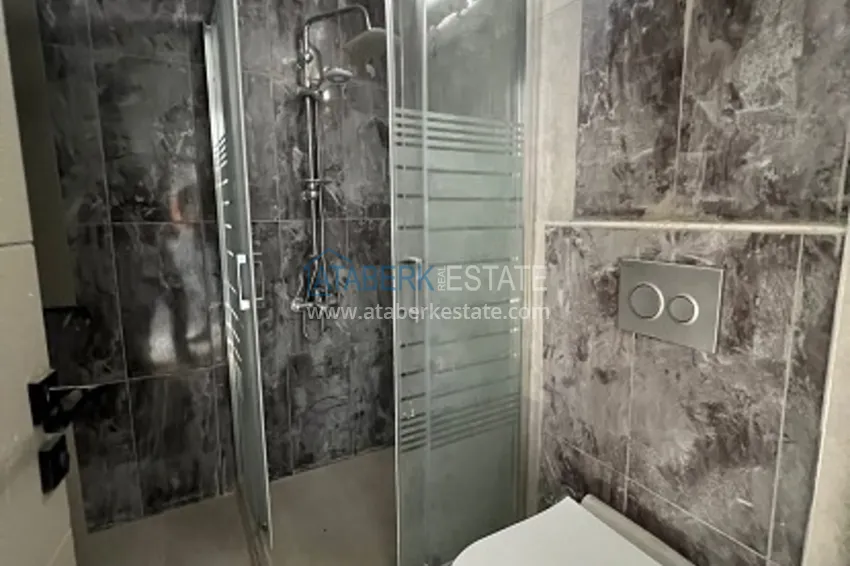 Квартира 1+1 с видом на море в районе Арпачбахшиш-Мерсин 13