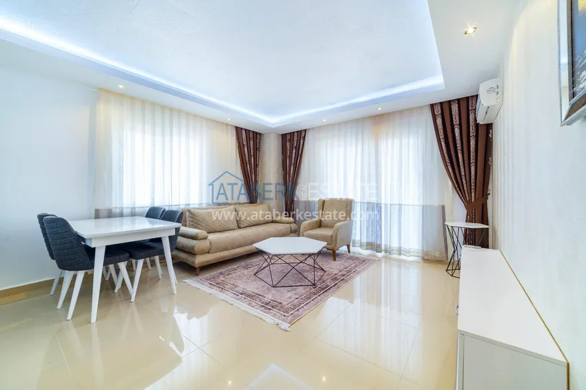 Purchase One bedroom apartment in Mahmutlar furnished with open sea views 2