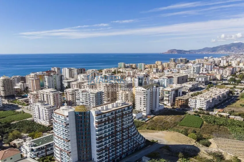 Apartment 3+1 with furniture and open mountain views. Mahmutlar District, Alanya 1