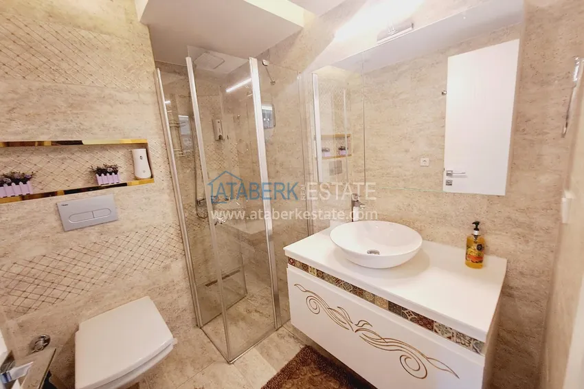 Purchase One bedroom apartment in the center of Alanya with furniture and access to a private beach 7 