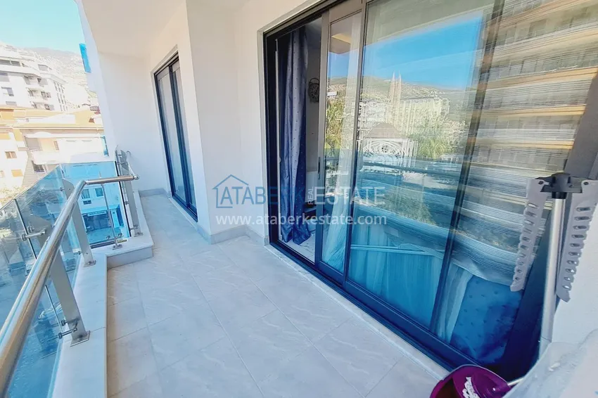 Purchase One bedroom apartment in the center of Alanya with furniture and access to a private beach 8 