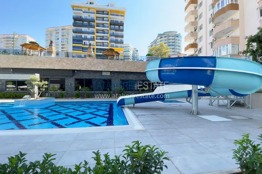1+1 apartment in Mahmutlar with furniture and mountain views 4