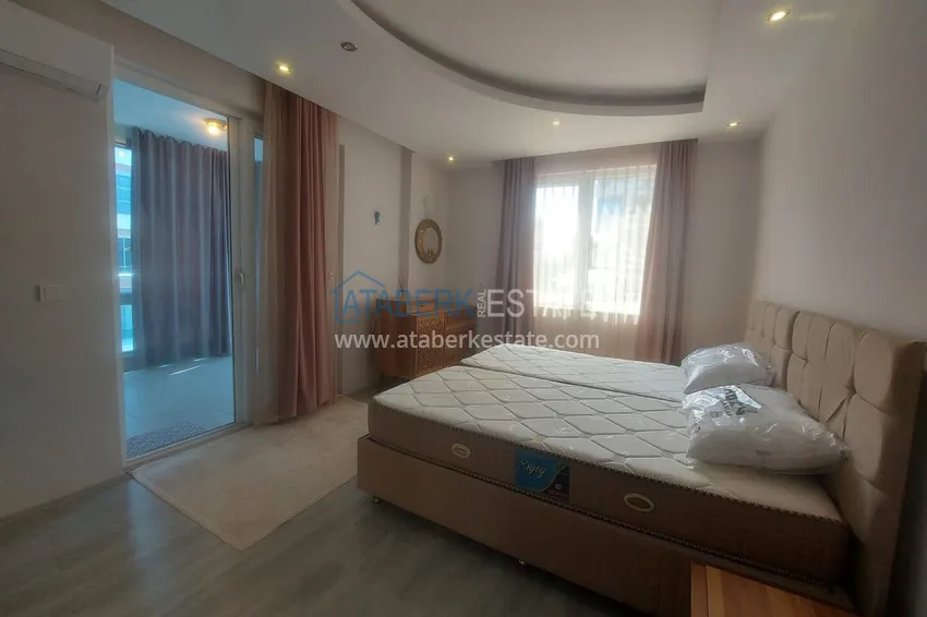 Kupuj Apartament 2+1 z meblami i dwoma przeszklonymi balkonami 450 metrów od morza - Mahmutlar 9
