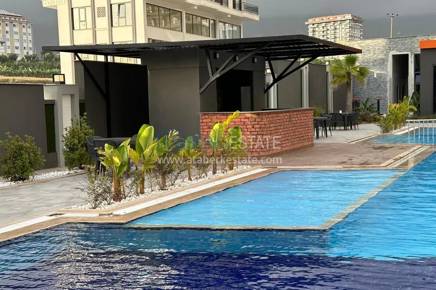2+1 apartment with furniture, glazed balcony and sea view in the center of Mahmutlar, Alanya 3 