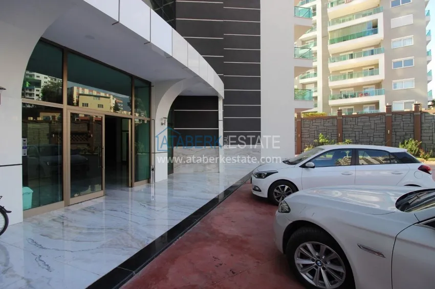 Turnkey 1+1 75 m² apartment with sea view in Mahmutlar 16