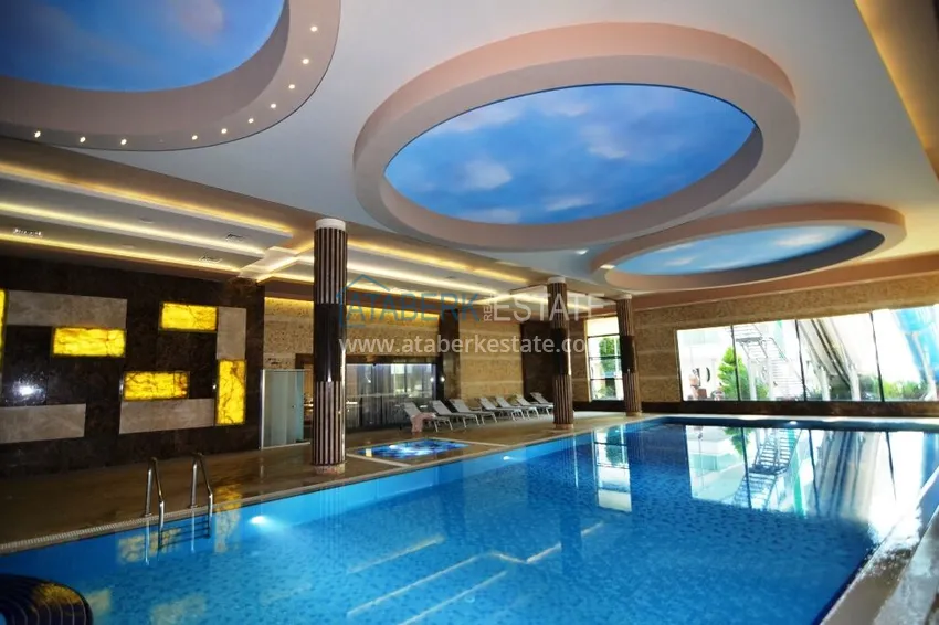 Garden duplex 3+1 in Kargicak with furniture - property under citizenship 15 