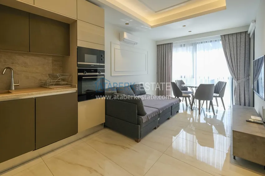 Kupuj Apartament 1+1 przy plaży w Mahmutlar — umeblowany i z panoramicznym widokiem na morze 1 