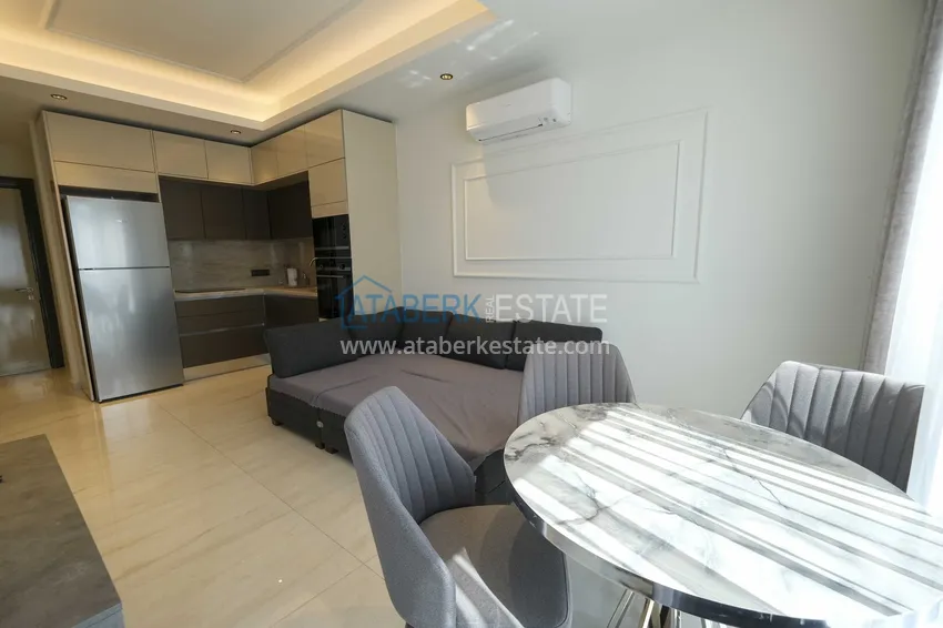 Kupuj Apartament 1+1 przy plaży w Mahmutlar — umeblowany i z panoramicznym widokiem na morze 3 