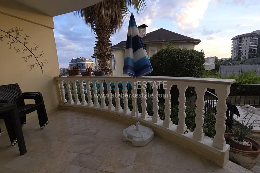 Purchase 2+1 apartment with furniture and access to the garden in the Avsallar area 33