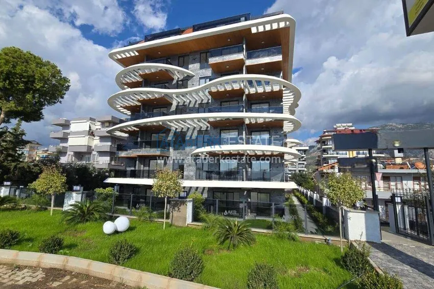 1+1 apartment overlooking the sea and the fortress on the beachfront in Kestel 13 