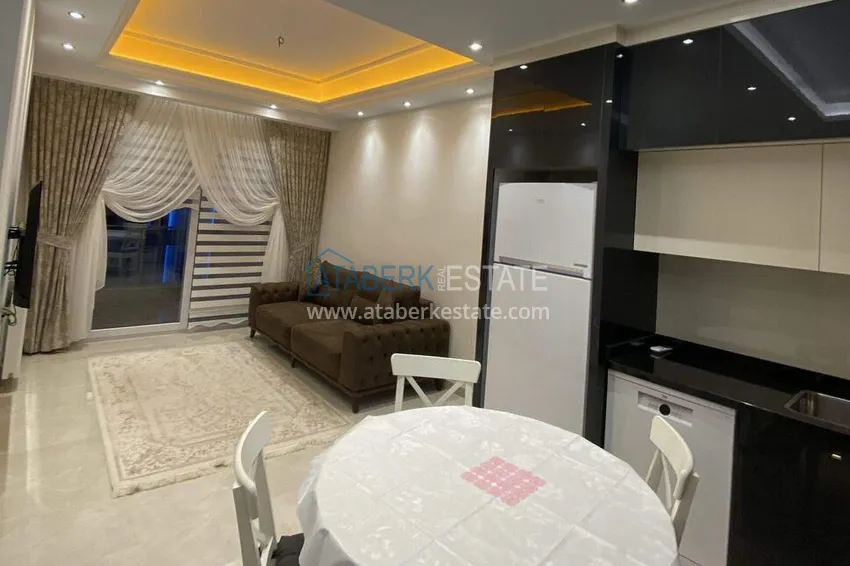 Purchase 1+1 apartment 70 m² in the center of Mahmutlar — furnished, glazed balcony, installments up to 1 year 2