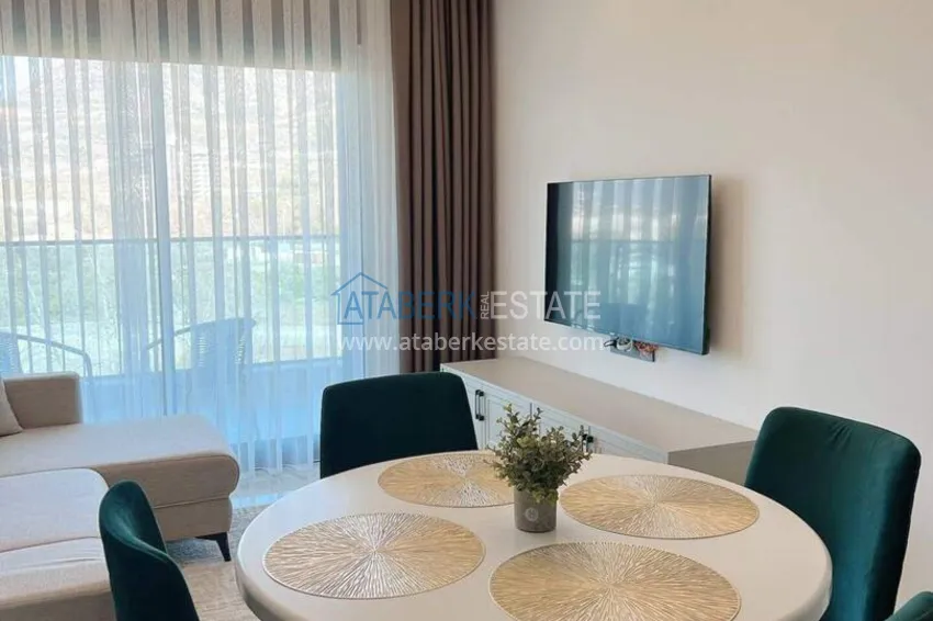 Purchase 1+1 apartment for rent in Mahmutlar — furnished and with views of the A40 mountains 3