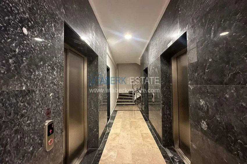 Finished two-bedroom apartment in a complex under completion in Mahmutlar 10 