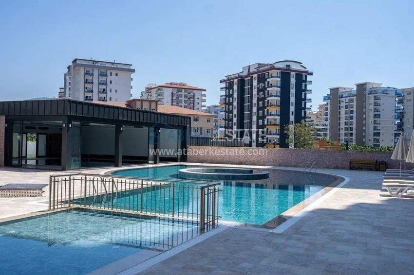 Finished two-bedroom apartment in a complex under completion in Mahmutlar 4 