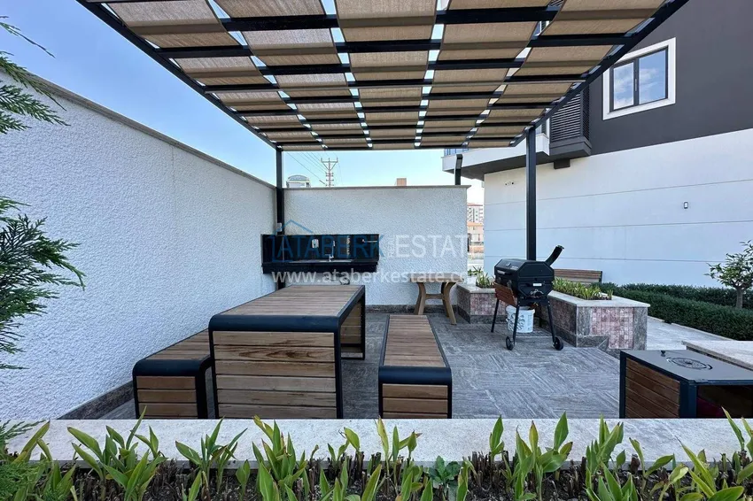 Finished two-bedroom apartment in a complex under completion in Mahmutlar 7 