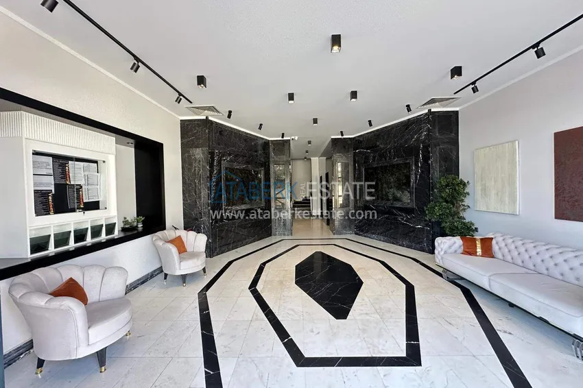 Finished two-bedroom apartment in a complex under completion in Mahmutlar 8 