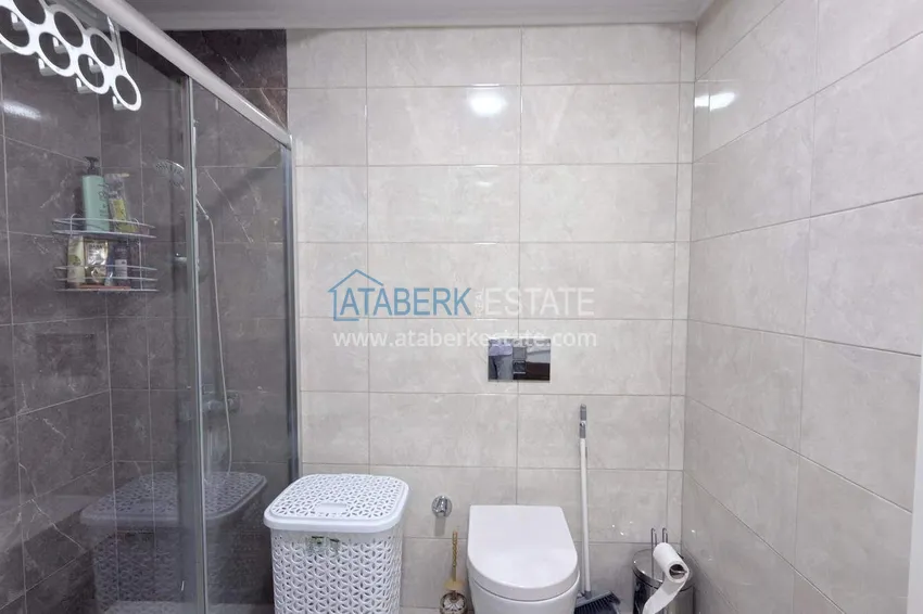 Purchase Apartment 1+1 in the center of Mahmutlar - on the 12th floor with furniture and mountain views 10